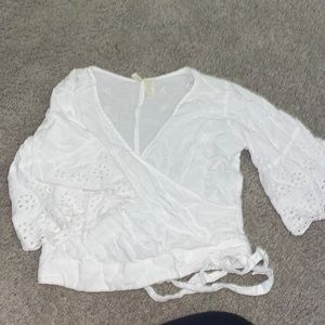 White top has flowers down it